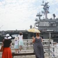 The U.S. aircraft carrier Ronald Reagan returns to the U.S. Yokosuka Naval Base Wednesday after a nearly three-month mission that included patrols and drills in the Sea of Japan. | KYODO