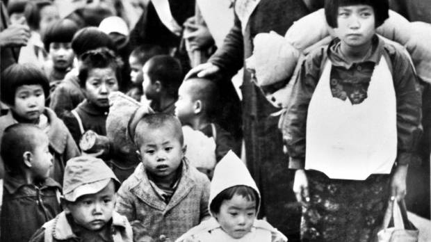Children displaced in Manchuria, many having lost their parents, arrive at Shinagawa Station in Tokyo on Dec. 5, 1946. Postwar Japanese retell war accounts to preserve vital history