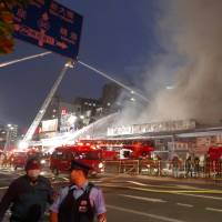 Fire trucks are seen lined up on the main road close the famed Tsukiji fish market in central Tokyo late Thursday afternoon after a fire broke out. There were no reports of any injuries. Fire near Tsukiji fish market extinguished after 15-hour battle; no injuries reported