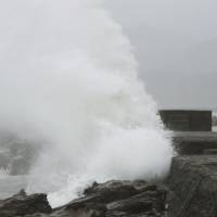 High waves pound the coast of Kushima, Miyazaki Prefecture, Sunday afternoon as Typhoon Noru approaches. | KYODO