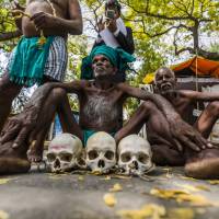Indian farmers from the state of Tamil Nadu protest March 24 in New Delhi with the skulls of farmers who committed suicide in their region following devastating crop losses. Weathering the violence caused by climate change