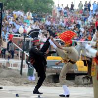 Indian (right) and Pakistani border guards take part in a nightly ceremony at the India-Pakistan border in Wagah on Aug. 2. From barbed grins in a carefully synchronised daily flag ceremony to murderous exchanges across barbed wire in Kashmir, the India-Pakistan border is a 70-year-old scar that will not heal. The tragedy of India's partition, 70 years on