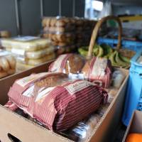 Food collected by Second Harvest Japan sits in the back of a truck. Food for thought: Government agencies are joining private initiatives to tackle the growing problem of food waste in Japan