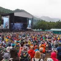 Rainy plain: Australian rockers Jet perform on the main Green Stage at Fuji Rock Festival on Sunday. People began arriving at Naeba Ski Resort in Niigata Prefecture on Thursday night last week for a weekend of musical performances. Fuji Rock Festival: It may not make sense on paper, but the end results are glorious