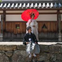 A strong start: The grounds of Hiroshima Castle are a good setting for wedding photos. Hiroshima's past is one of many reasons to pay a visit