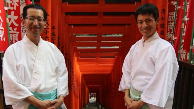 Dressed to impress: Hie Shrine priests Hiroyuki Korehisa (left) and Hiroyuki Uchida stand in front of Sanno Inari Shrine’s torii. Akasaka: Sublime and surreal spots in Tokyo's government district