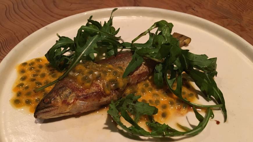 <em>Ayu</em> (sweetfish) confit, served with a passion fruit sauce at Umbilical in Sangenjaya. Umbilical