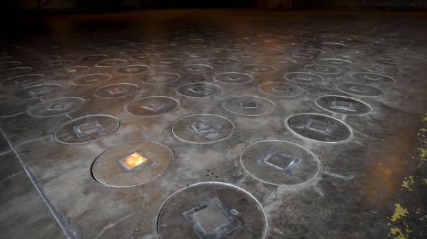 This 2013 file photo shows radioactive waste sealed in large stainless steel canisters under a five-feet of concrete in a controversial storage facility near Aiken, South Carolina. The Ministry of Economy, Trade and Industry has plans to dispose of Japan’s nuclear waste using similar means. METI seeks to pass nuclear buck with release of waste disposal map