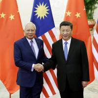 Malaysian Prime Minister Najib Razak (left) poses with Chinese President Xi Jinping before a meeting ahead of the Belt and Road Forum in Beijing on May 13. Under the Najib government, Malaysia is rapidly growing closer to China. Have we lost ASEAN to China?