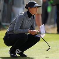 Michelle Wie lines up a putt during the first round of the Women\'s British Open on Thursday in St. Andrews, Scotland. | ACTION IMAGES VIA REUTERS