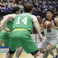 Japan’s Tenketsu Harimoto carries the ball during Tuesday’s 84-68 defeat to Australia at the FIBA Asia Cup in Zouk Mikael, Lebanon. Japan loses to Australia in FIBA Asia Cup opener