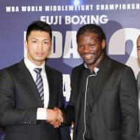 Ryota Murata and Hassan N’Dam shake hands at a news conference on Thursday in Tokyo announcing a rematch for the WBA middleweight title. Murata-N'Dam rematch set for Oct. 22 at Ryogoku Kokugikan