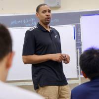 Utah Jazz assistant coach and former Japan Basketball League coach and player Antonio Lang speaks to Japanese coaches and administrators during Wednesday’s seminar in Tokyo. Jazz assistant coach Lang values Japan experience