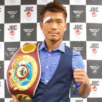 WBO flyweight champion Sho Kimura poses for photos during a news conference on Friday. | KYODO