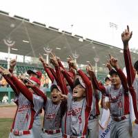 Tokyo Kitasuna, representing Japan, celebrates after winning the Little World Series on Sunday in South Williamsport, Pennsylvania. Japan rolls to Little League World Series title