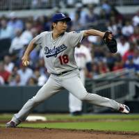 Los Angeles starting pitcher Kenta Maeda prepares to deliver a pitch during the Dodgers’ 3-2 win over the Braves on Tuesday. Maeda states case to keep spot in rotation