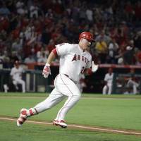 Los Angeles’ Mike Trout runs to first base after hitting a double for the 1,000th hit of his career in the fourth inning against Baltimore on Monday. Trout gets 1,000th career hit for Angels in loss
