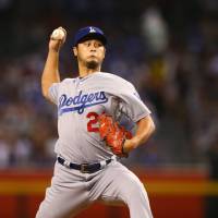 Los Angeles starter Yu Darvish pitches against Arizona in the first inning on Thursday night. Darvish, sluggers guide Dodgers past Diamondbacks
