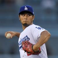 Dodgers hurler Yu Darvish delivers a pitch against the White Sox on Wednesday in Los Angeles. He allowed three home runs on his 31st birthday. Dodgers stage ninth-inning rally in dramatic triumph over White Sox