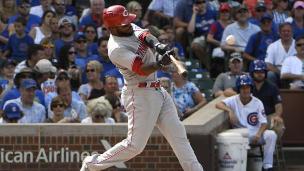 Cincinnati’s Phillip Ervin blasts a two-run homer against the Cubs in the seventh inning on Thursday in Chicago. Reds jump out to 9-0 lead, hold off Cubs in slugfest