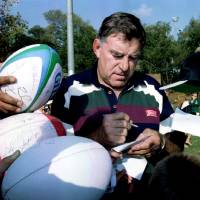 Colin Meads signs autographs for schoolchildren during the All Blacks’ visit to Johannesburg ahead of the 1995 Rugby World Cup. All Black legend Meads dies at 81