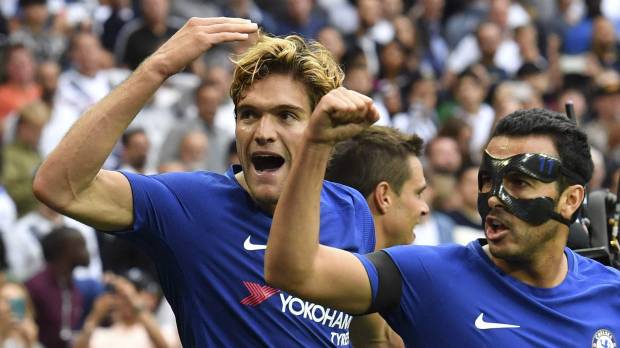 Chelsea’s Marcos Alonso (left) and Pedro celebrate after Alonso’s second goal against Tottenham during their match on Sunday in London. Chelsea adds to Tottenham's misery at Wembley