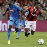 Napoli’s Kalidou Koulibaly (left) challenges Nice’s Allan Saint-Maximin during their Champions League playoff second leg on Tuesday in Nice, France. Napoli, Sevilla, Celtic reach Champions League group stage