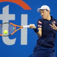 Kei Nishikori plays a shot during his second-round win over Donald Young of the United States at the Citi Open in Washington on Tuesday. | KYODO