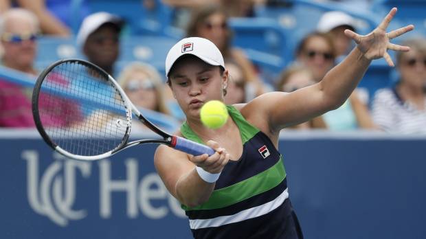 Ashleigh Barty hits a return to Venus Williams in a Western & Southern Open second-round match on Wednesday in Mason, Ohio. Barry ousted Williams, winning 6-3, 2-6, 6-2. Top seeds advance on day filled with upsets