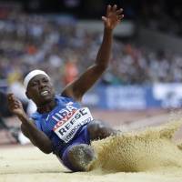 American Brittney Reese competes in the long jump final at the world championships on Friday. Reese won with a leap of 7.02 meters. | AP