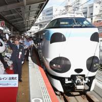 A Kuroshio limited express train repainted to resemble the face of a giant panda departs from JR Tennoji Station in Osaka on Saturday. A zoo in Shirahama, one of the towns in Wakayama Prefecture at which the train stops, has the popular animals on show. The panda-themed train will run until about November 2019. | KYODO