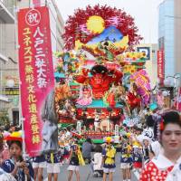 A float featuring mythical figures and kabuki actors is pulled along a street in Hachinohe, Aomori Prefecture, during the Hachinohe Sansha Festival on Tuesday. The annual event, which has a history of 290 years and was added to UNESCO\'s Intangible Cultural Heritage list last December, is held to pray for a rich harvest and express gratitude for the health of those living in the area. The festival runs until Friday. | KYODO