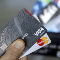 Credit cards are seen in Haverhill, Massachusetts, in June. Equifax, one of the three main credit reporting companies, said last week that a major data breach exposed Social Security numbers and other important information of millions of people. Hackers had access to Social Security numbers, birth dates, addresses, driver’s license numbers, credit card numbers and other information. Those are all crucial pieces of personal data that criminals could use to commit identity theft. 143 million Americans believed stung by Equifax data breach but firm's response satisfies none