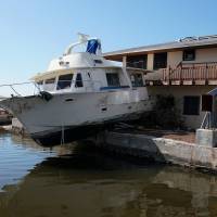 A damaged boat is pictured after Hurricane Irma in Cudjoe Key, Florida, Sunday. Irma damage a reminder of Florida economy's vulnerability but masses, and their money, still expected to come