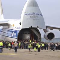 A Russian Antonov transport plane AN124 carries parts of Lufthansa plane ‘Landshut’ as it stands at the airport in Friedrichshafen, Germany, Saturday. The Lufthansa passenger jet hijacked to Somalia 40 years ago at the height of the leftist Red Army Faction’s campaign against West German authorities has returned home. The dpa news agency reported Saturday most parts of the Boeing 737 arrived Saturday in the southern city of Friedrichshafen, where they will be reassembled and displayed at the Dornier Museum. Lufthansa jetliner hijacked to Somalia in 1977 brought back to Germany