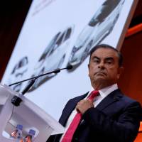 Carlos Ghosn, chairman and CEO of the Renault-Nissan-Mitsubishi alliance, attends a news conference in Paris on Friday. Renault-Nissan-Mitsubishi bets on spike in electric cars with 12 new models