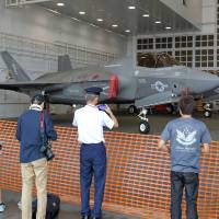 Visitors look at a U.S. F-35B Lightning II during an air show at the Air Self-Defense Forces Misawa airbase in Aomori Prefecture on Sept. 10. Japanese firms said behind schedule in joining F-35A production