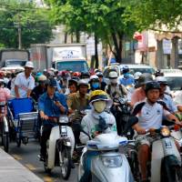 Motorcycles form a traffic jam in Ho Chi Minh City. Industry minister Hiroshige Seko and his Vietnamese counterpart, Tran Tuan Anh, have confirmed that Japan will help the Southeast Asian country boost its industrial competitiveness. Japan to help boost Vietnam's industrial competitiveness