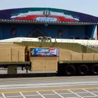 The new Iranian long-range missile Khoramshahr is displayed in Tehran on Friday during the annual military parade marking the anniversary of the outbreak of the devastating 1980-1988 war with Iraq. Defying U.S., Iran unveils new missile during parade