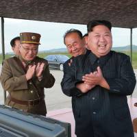 North Korean leader Kim Jong Un views the launch drill for an intermediate range Hwasong-12 ballistic missile at an undisclosed location in this picture released Saturday. Spain expels North Korean ambassador over nuclear tests