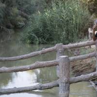 Italian star tenor Andrea Bocelli, 58, a Catholic, makes the sign of the cross at the edge of the Jordan River, attended by a priest, at Al-Maghtas, Jordan. Bocelli prayed at the traditional site of Jesus’ baptism and told The Associated Press that he “prayed for peace in the world.” Tenor Andrea Bocelli prays at River Jordan site of Jesus baptism