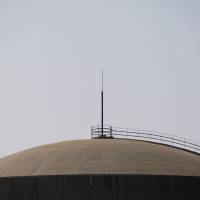 A dome tops off a nuclear reactor at a Chinese power plant in Daya Bay, near Shenzhen. Nuclear experts head to China to test experimental reactors