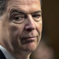 Former FBI director James Comey testifies before the Senate Select Committee on Intelligence, on Capitol Hill in Washington in June. The Republican attacks on fired FBI Director James Comey have sharply intensified in the last two weeks, with broadsides delivered on Twitter, public statements and even from the White House podium. As Mueller probe intensifies over last two weeks, so do Trump camp's attacks on Comey