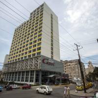 The Hotel Capri in Havana, is photographed Tuesday. New details about a string of mysterious “health attacks” on U.S. diplomats in Cuba indicate the incidents were narrowly confined within specific rooms or parts of rooms. Aside from their homes, officials said Americans were attacked in at least one hotel, the recently renovated Hotel Capri, steps from the Malecon, Havana’s iconic, waterside promenade. U.S. aggressively probing alleged 'acoustic attacks' that hurt 21 embassy workers in Havana