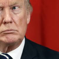 U.S. President Donald Trump listens during a meeting with Prime Minister Shinzo Abe at the Palace Hotel during the United Nations General Assembly on Thursday in New York. Twenty-one U.S. states notified by federal government they were targets of election hacking