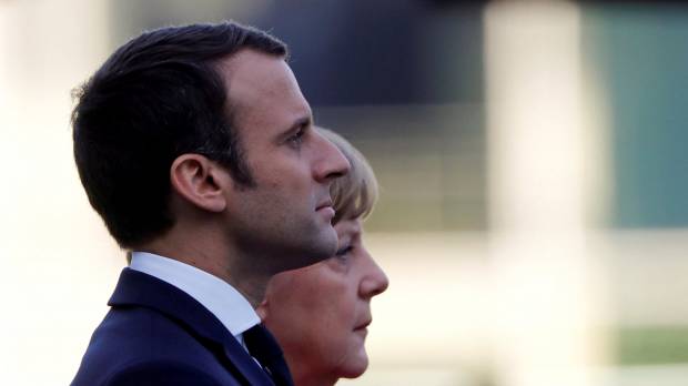 German Chancellor Angela Merkel and French President Emmanuel Macron attend a welcome ceremony at the Chancellery in Berlin in May. German election result could spell trouble for Merkel-Macron deal on Europe