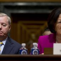 Sen. Mazie Hirono, D-Hawaii, accompanied by Sen. Lindsey Graham, R-S.C., speaks during a Senate Finance Committee hearing to consider the Graham-Cassidy healthcare proposal, on Capitol Hill Monday in Washington. Senator seen effectively dooming Obamacare repeal bill despite GOP move to woo holdouts