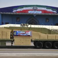 Iran’s Khoramshahr missile is displayed by the Revolutionary Guard during a military parade marking the 37th anniversary of Iraq’s 1980 invasion of Iran, in front of the shrine of late revolutionary founder Ayatollah Khomeini, just outside Tehran, on Friday. Defying Trump, Iran says it will boost missile capabilities