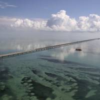 This Wednesday photo shows no traffic on the 7 mile bridge after Hurricane Irma hit the Florida Keys. Irma's two-week frenzy of fear, death, historic devastation ends with Indiana rainstorm