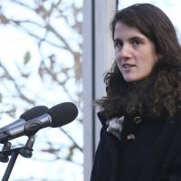 In this Nov. 22, 2013, photo, Tatiana Schlossberg granddaughter of President John F. Kennedy, makes a short speech during a ceremony at the JFK memorial at Runnymede, England. The New York Times reported that Schlossberg married George Moran on Saturday in Massachusetts. JFK's granddaughter, Tatiana Schlossberg, ties knot